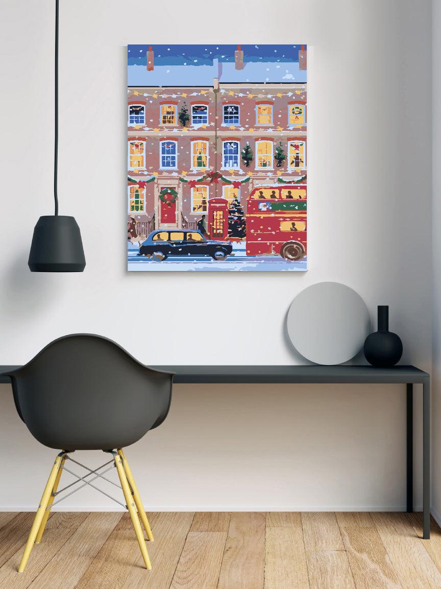 a room with a desk, chair and a painting on the wall